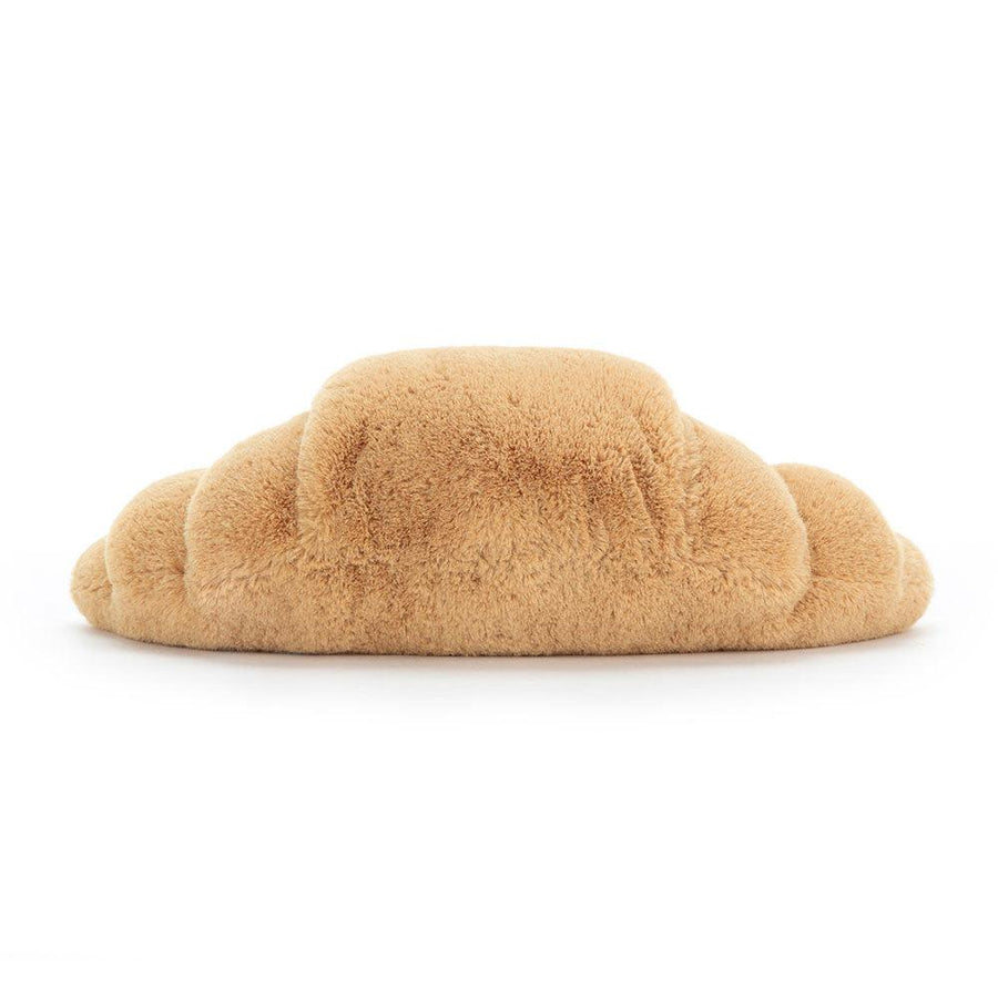 Jellycat Amuseables Croissant detalj – nærbilde av smilende ansikt og gyllen croissant-tekstur
