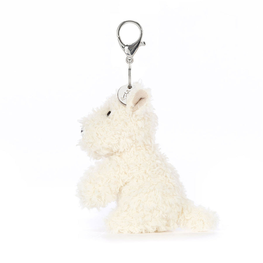 Jellycat Munro Scottie Dog Bag Charm detalj – nærbilde av brodert hundeansikt og metallfeste