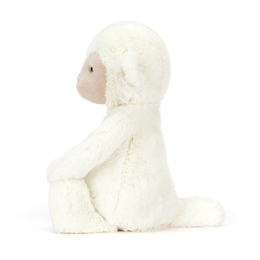 Jellycat Skipson Lamb sett fra siden – kremhvit plysj lam med myke bein