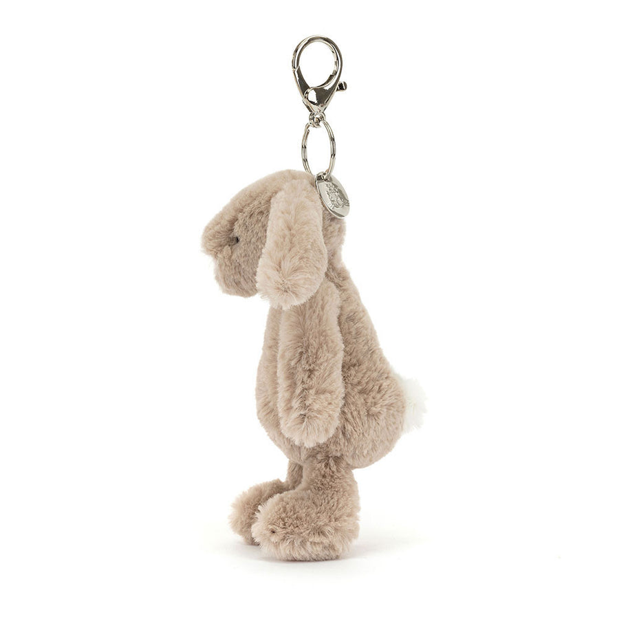 Jellycat Bashful Bunny Beige Bag Charm detalj – nærbilde av brodert ansikt og metallfeste